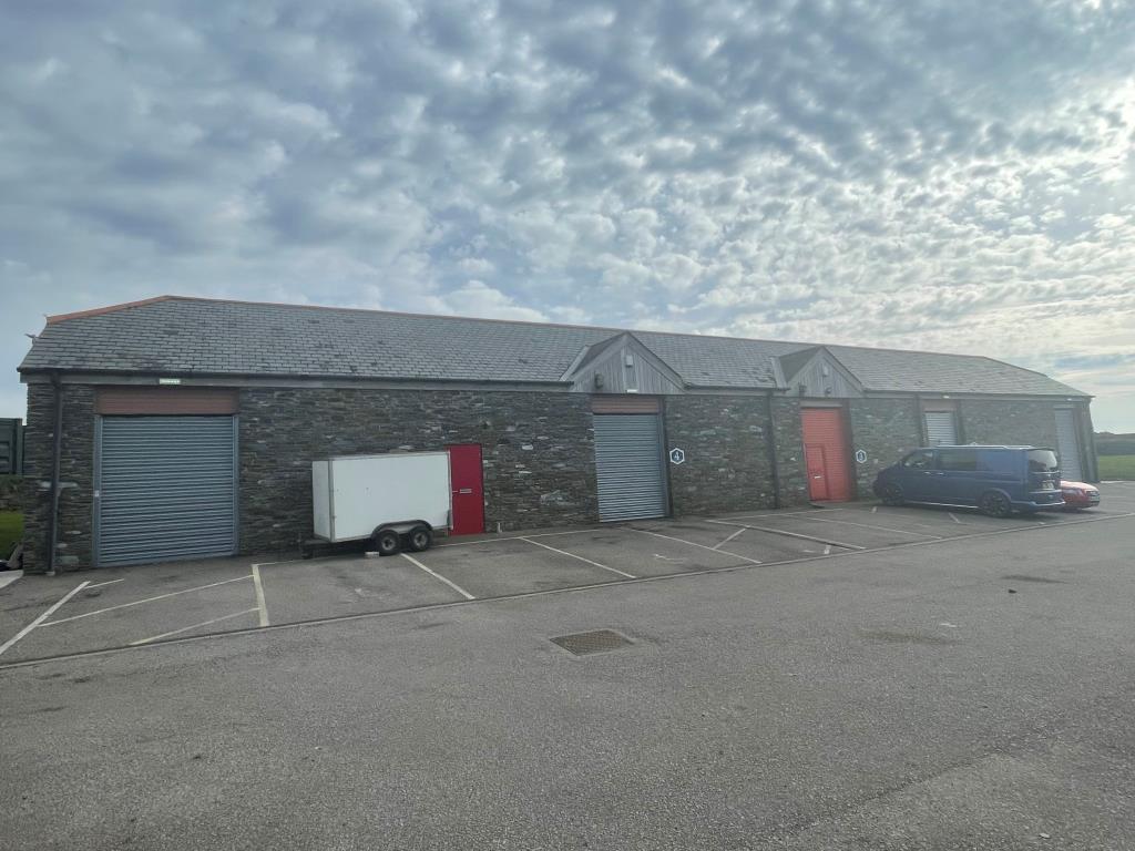 Lot: 80 - FREEHOLD BUSINESS PARK FOR INVESTMENT - Exterior photo showing terrace comprising units 1, 2, 3, 4 and 5